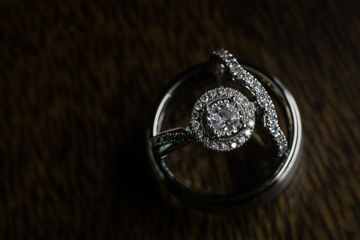 A diamond ring photographed on a plain surface