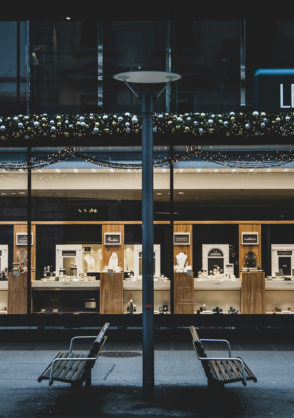 A lit jewellery storefront after dark
