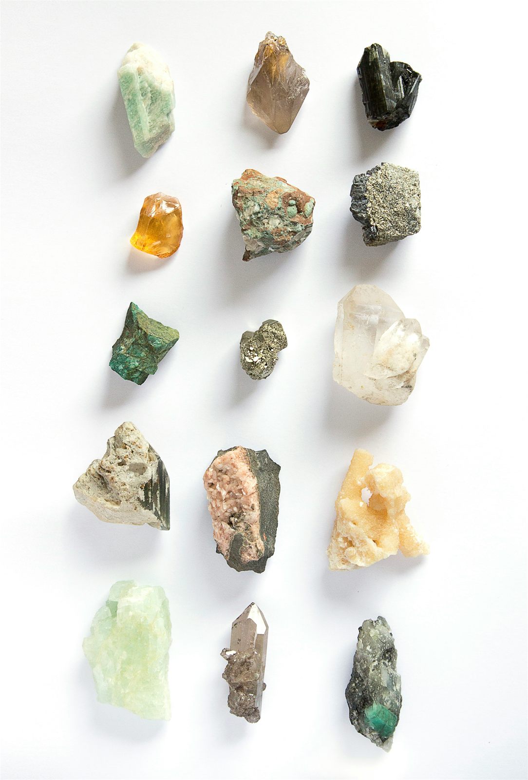Uncut gemstones arranged on a flat surface